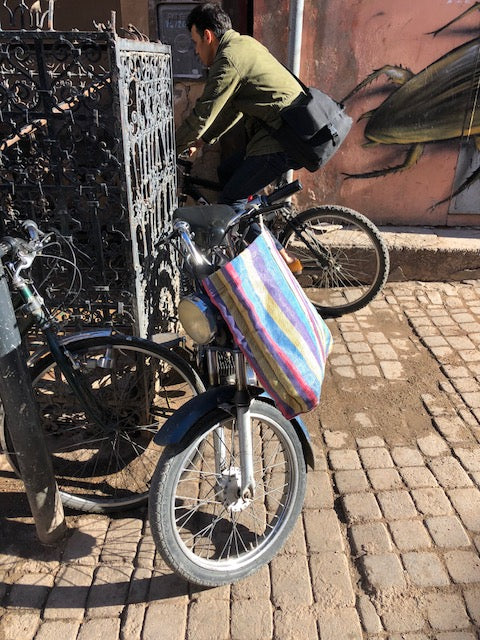 Colorful moroccan shopping bag on bicycle in town. 