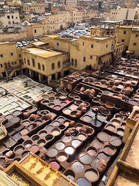 Overhead view of Fez town and assorted dyed leather being laid out dry.