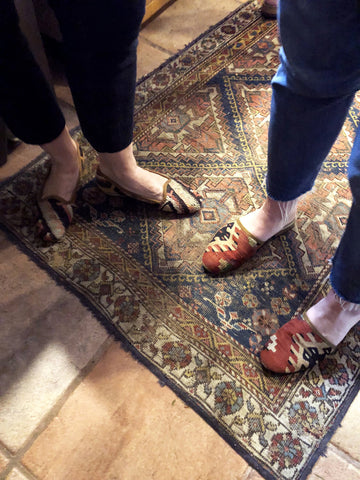 womens kilim loafers and womens kilim slides on kilim carpet.