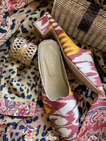 silk-ikat-mules-layered-over-leopard-and-paisley-with-raffia-napkin-ring