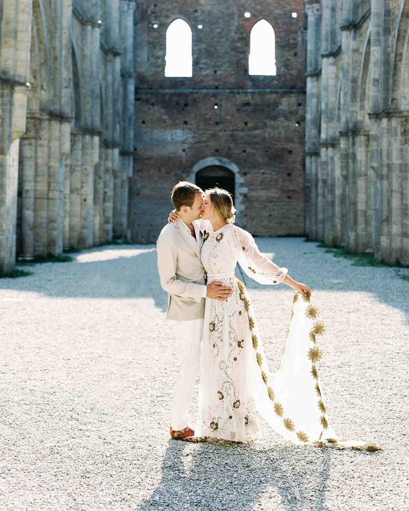 Bride and Groom embracing while wearing kilim shoes
