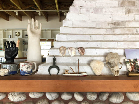 shells and various maine memorable on white mantel. 