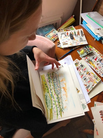 pauline showing her watercolor illustrations of different kilim shoes, carpets, and favorite places. 