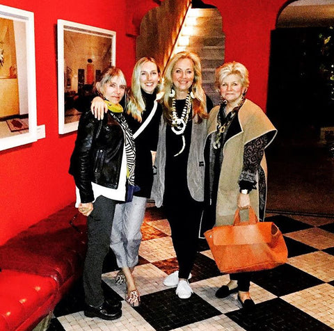 Milicent's mom, Milicent, Susan Walker and Charlotte Moss in red restaurant lobby in Morocco.