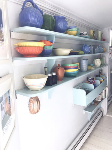 assorted colorful ceramics on display in provincetown, cape cod home.