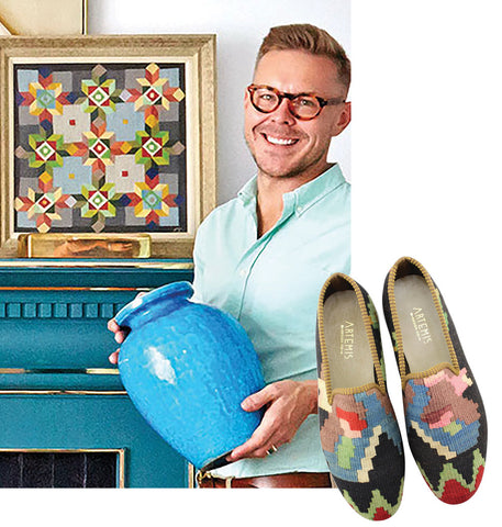 eddie ross holding blue ceramic vase paired with mens kilim loafers with dark base and colorful accents.