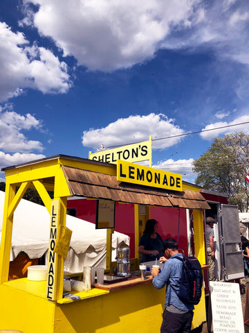 yellow lemonade stand at brimfield antique market.