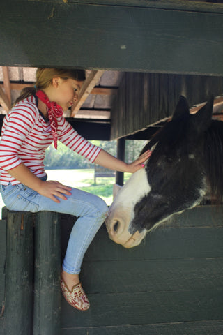 caroline petting horse in sumak kilim loafers, part of childrens shoes collection.
