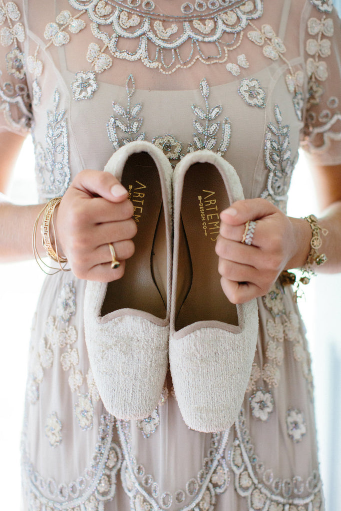 Sister of the bride holding our silk velvet loafers.