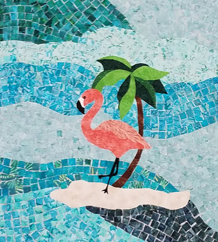 Pink flamingo standing on a tiny island surrounded by tiny fabric blue tiles.  Flamingo Island quilt pattern by Jackie Vujcich coming soon to Colorado Creations Quilting