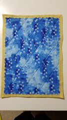 finished quilt showing fused scallop binding