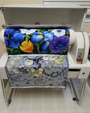 Image of fabric coming out of the Mangle ironing machine by Colorado Creations Quilting