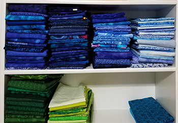 Organized and folded blue fabric 