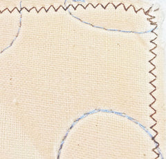 zigzag stitch secures 3 layers of a quilt