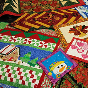 Christmas quilts designed and made by Jackie Vujcich of Colorado Creations Quilting