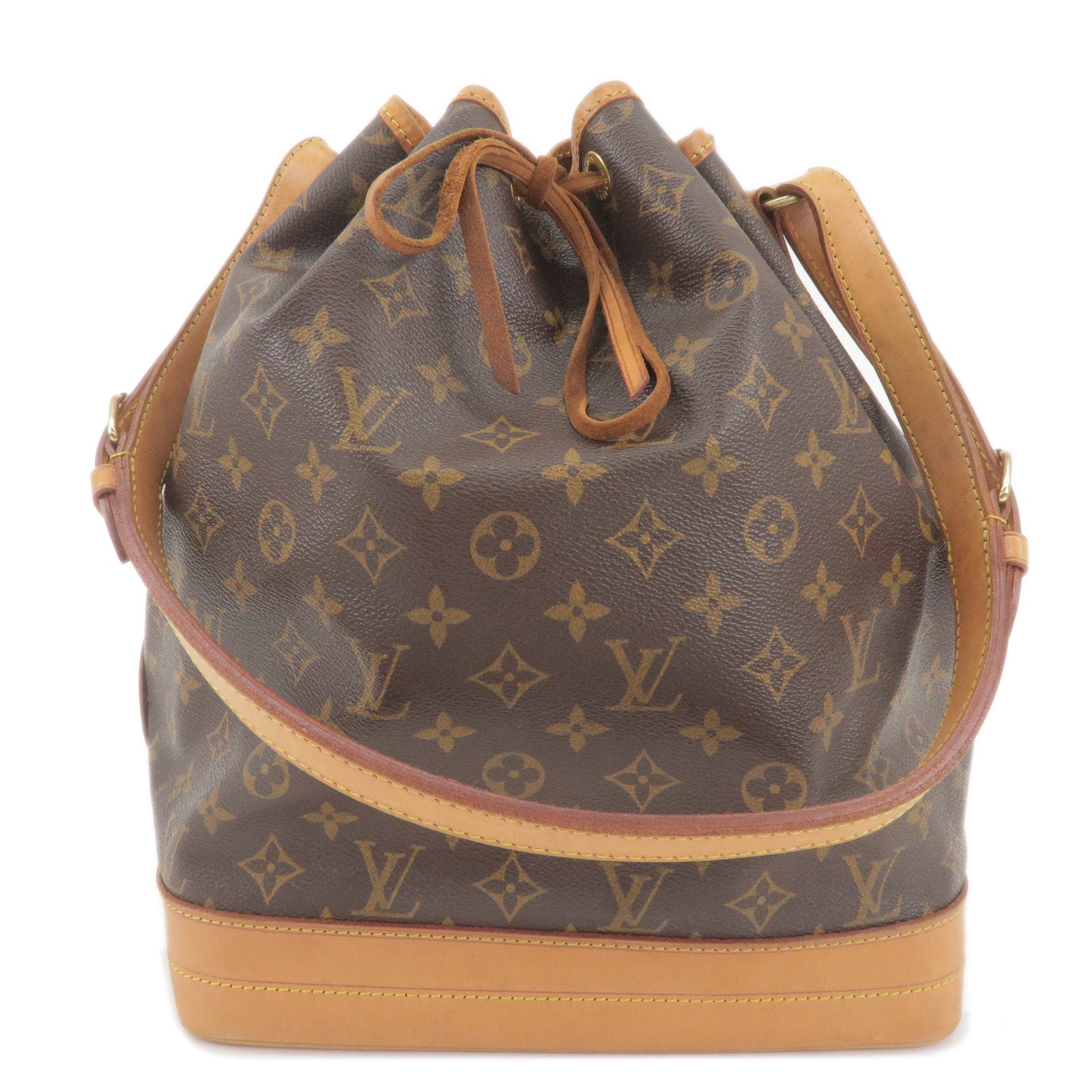 Woman with beige, brown and blue Louis Vuitton bag with golden and