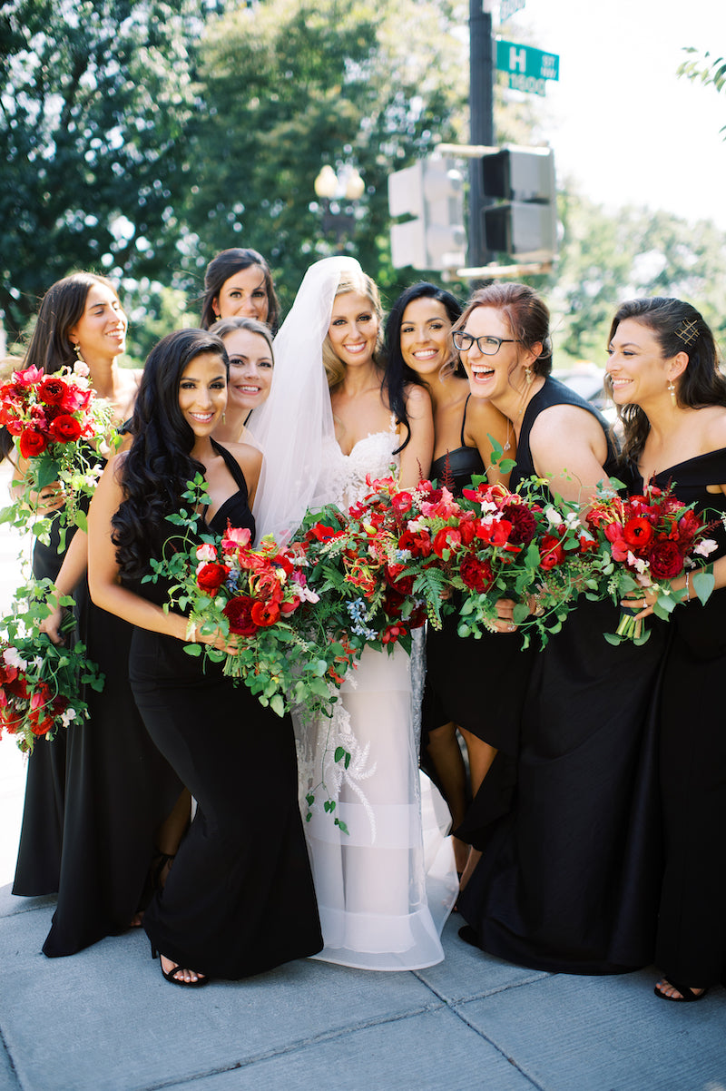 Black Bridesmaid Dresses with Red Floral Bouquets