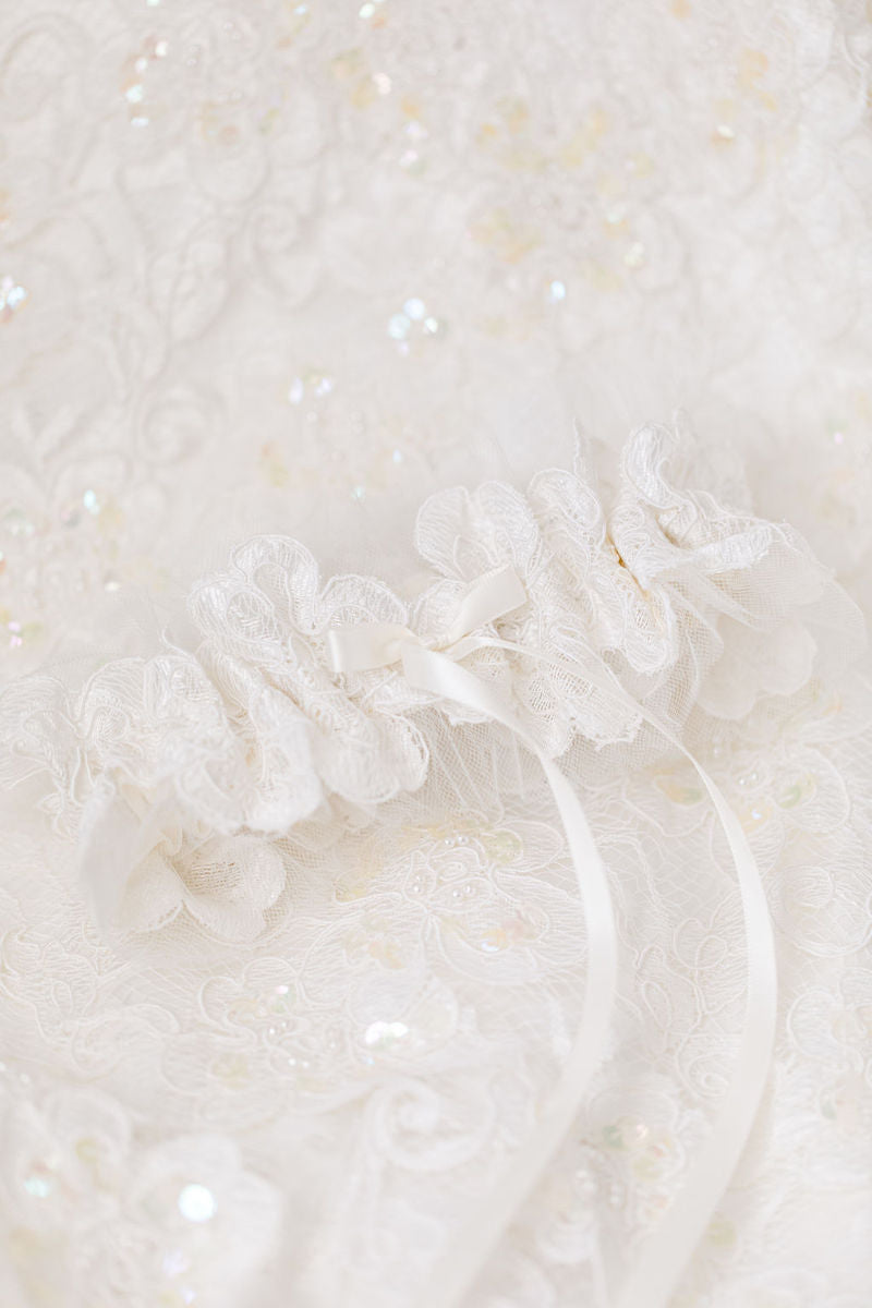custom wedding garter made from the bride's mother's wedding dress and veil