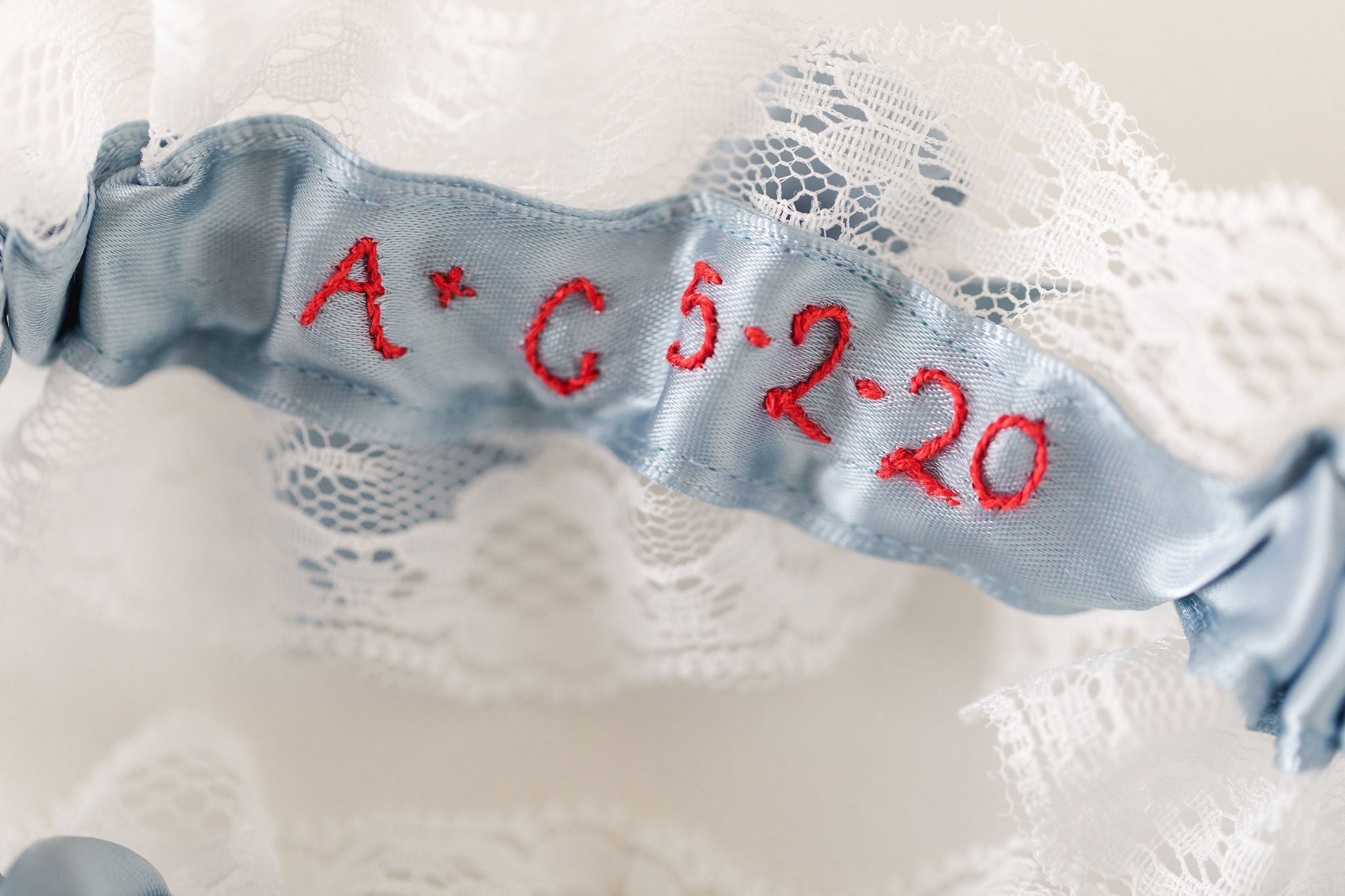 custom lace wedding garter set with personalized embroidery handmade by The Garter Girl