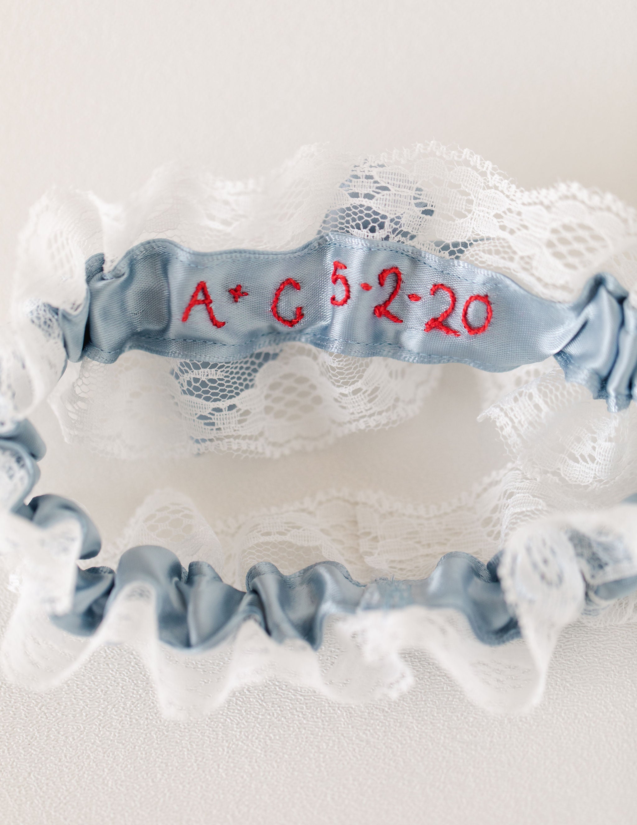 custom lace wedding garter set with personalized embroidery handmade by The Garter Girl