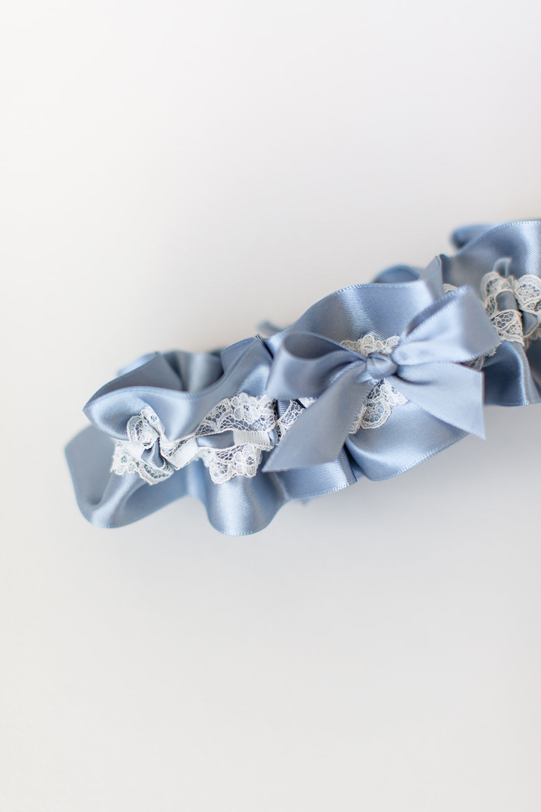custom garter with dusty blue and ivory lace