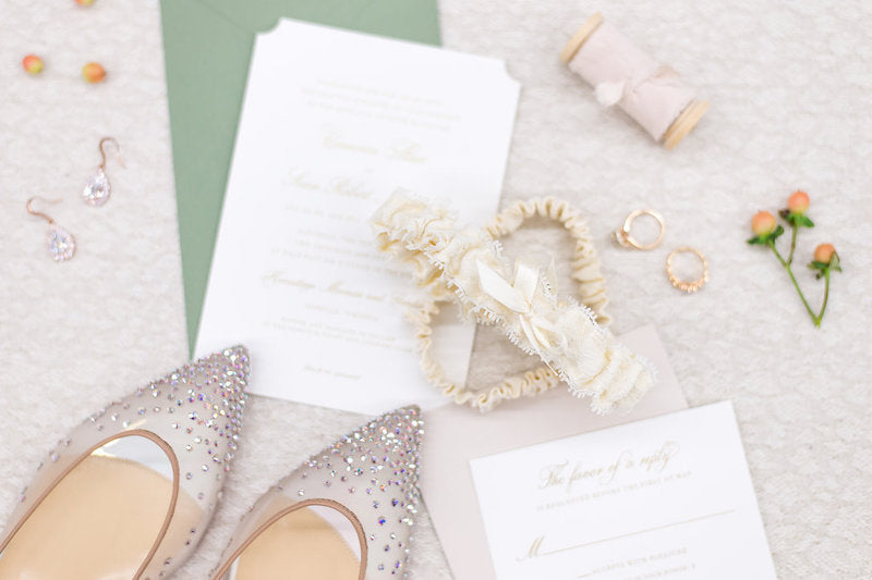 lace wedding garter and sage wedding invitations and sparkle bridal shoes