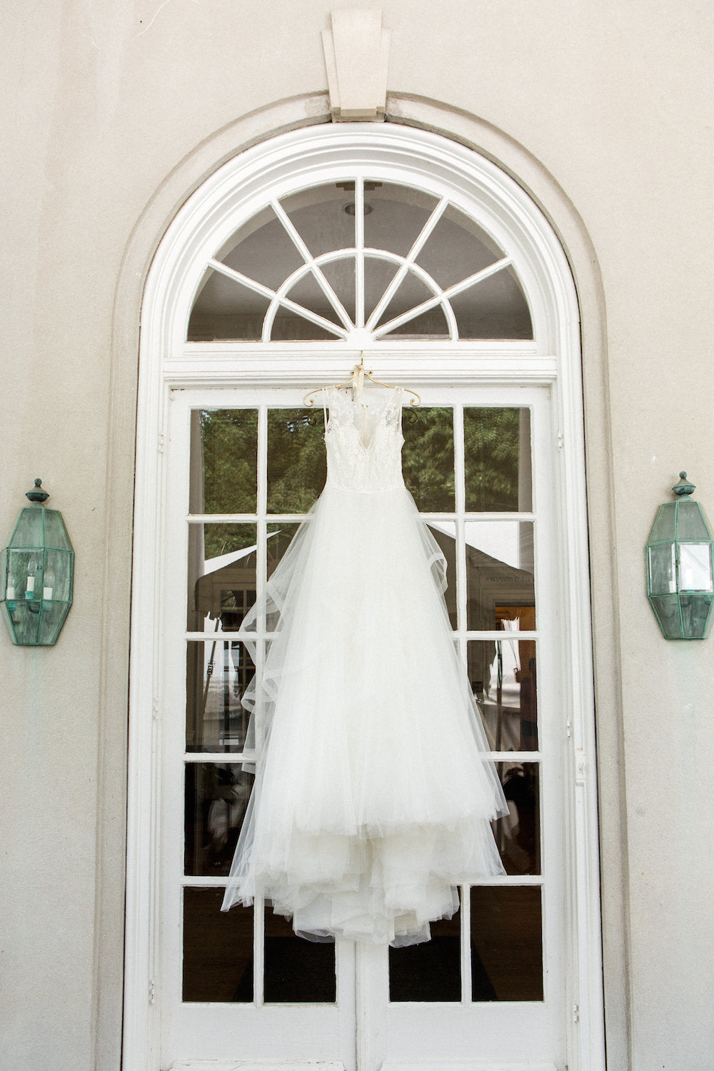 hanging wedding dress - tips about trying wedding dresses on at home from The Garter Girl