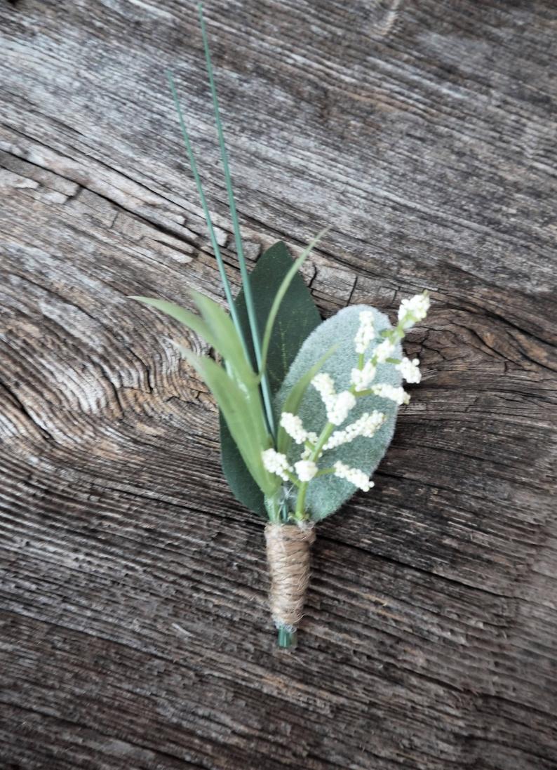 rustic eucalyptus wedding boutonniere for the groom