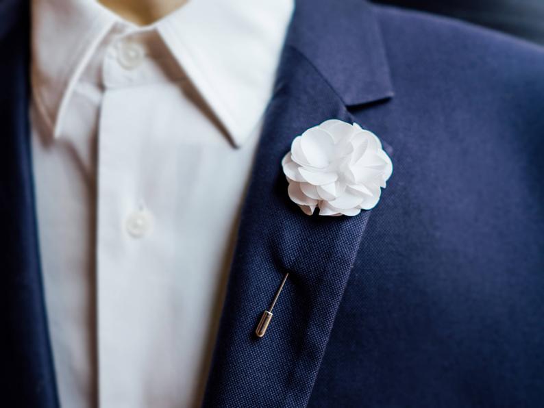 simple white lapel pin flower for the groom