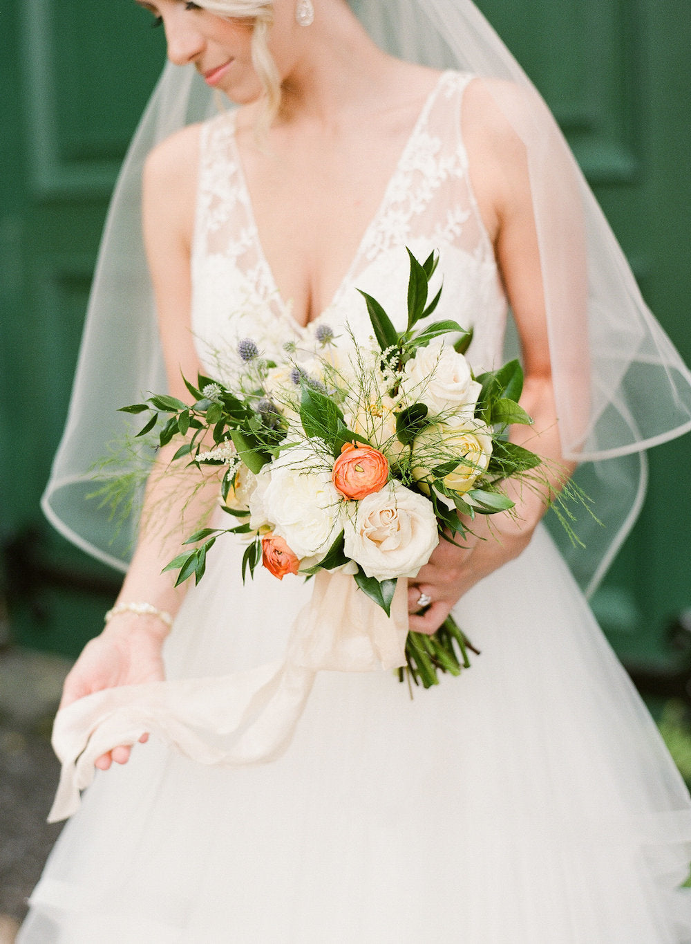 bride w spring bridal bouquet - tips about trying wedding dresses on at home from The Garter Girl