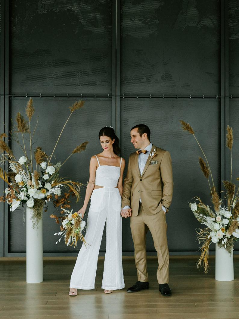 white cutout jump suit rehearsal dinner outfit