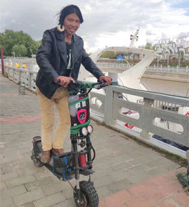 Tibet local on wolf scooter