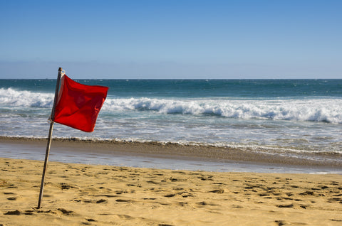 red beach warning flag