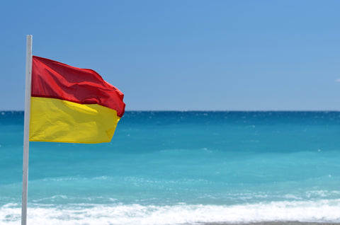 red over yellow beach flag