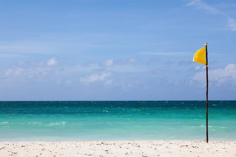 yellow beach warning flag