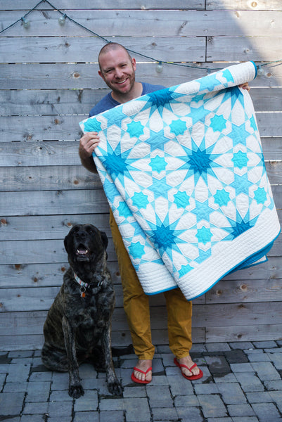 Holding finished quilt outside with Daphne, the English Mastiff.