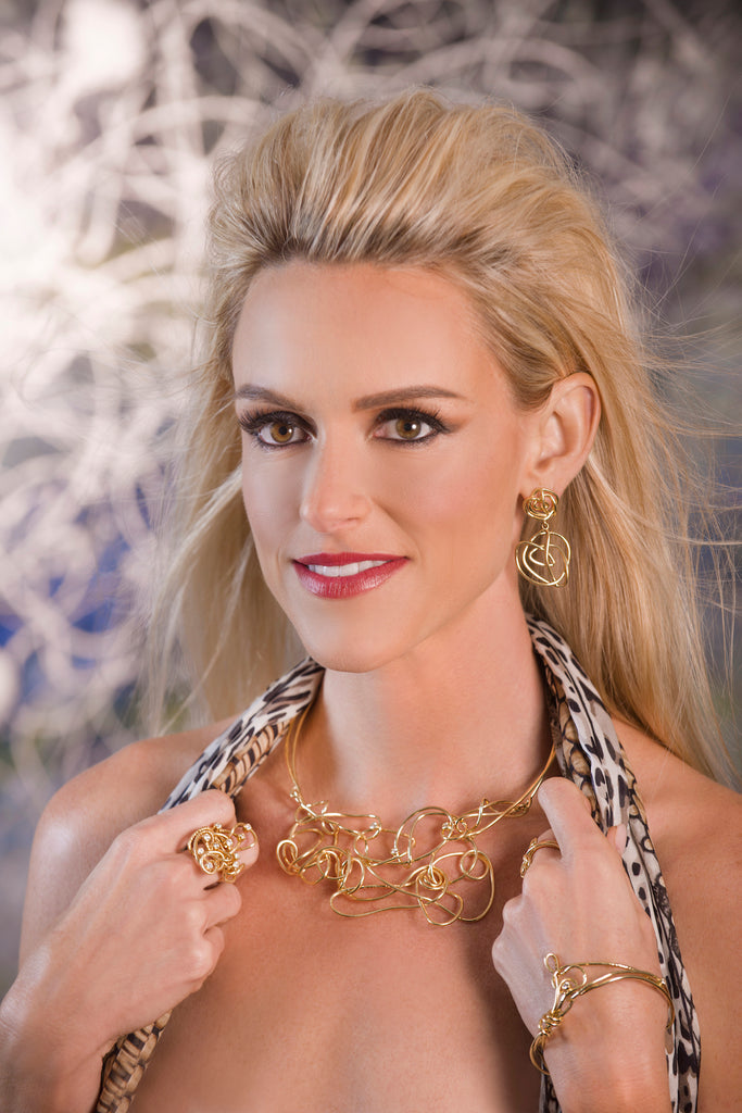 Model wearing 18kt gold jewelry by Nikki Sedacca