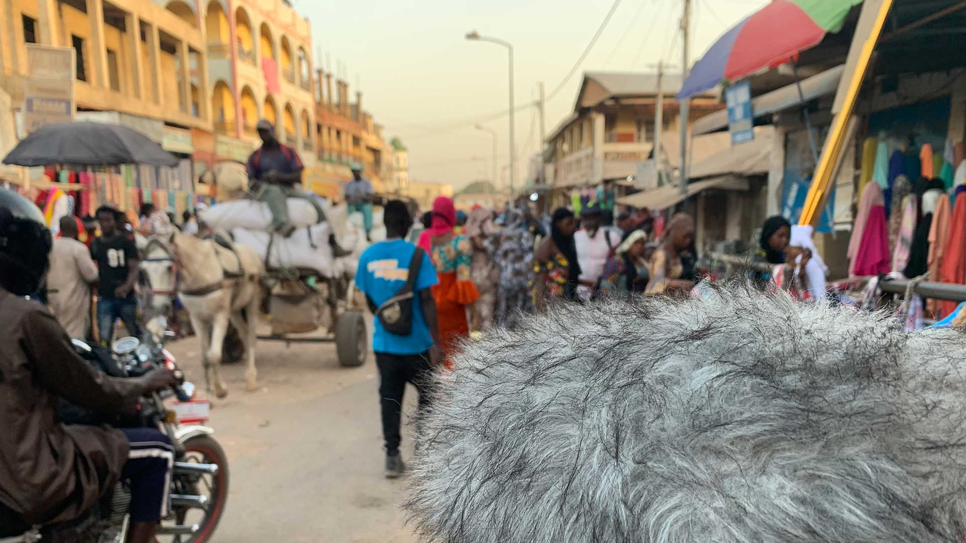 Recording in a market in The Gambia