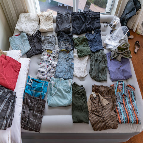 <img src="IMG-5869"alt="clothes folded on blow up bed">