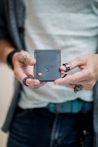 PlayHardLookDope CEO Jon Nelsen modeling their new top grain leather wallet in Ocean blue color