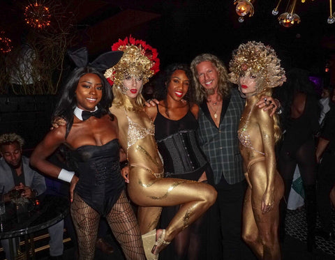 PlayHardLookDope at the Playboy NYC club Masquerade party inside posing with a playmate and two ambiance performers