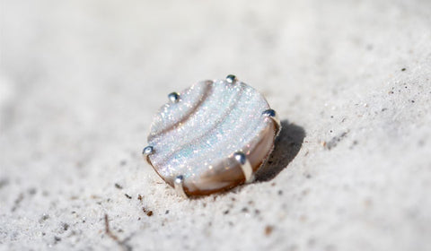 Drusy ring in the sand