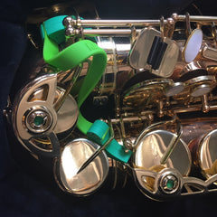 Key Leaves props on an alto saxophone to stop sticky Eb G# and C# key pads.