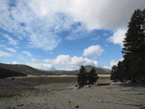 Mountain scape with lake trees and clouds