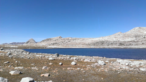 Mountain scape with lake trees and clouds