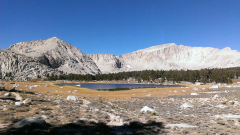 Mountain scape with lake trees and clouds