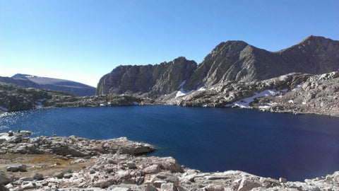 Mountain scape with lake trees and clouds