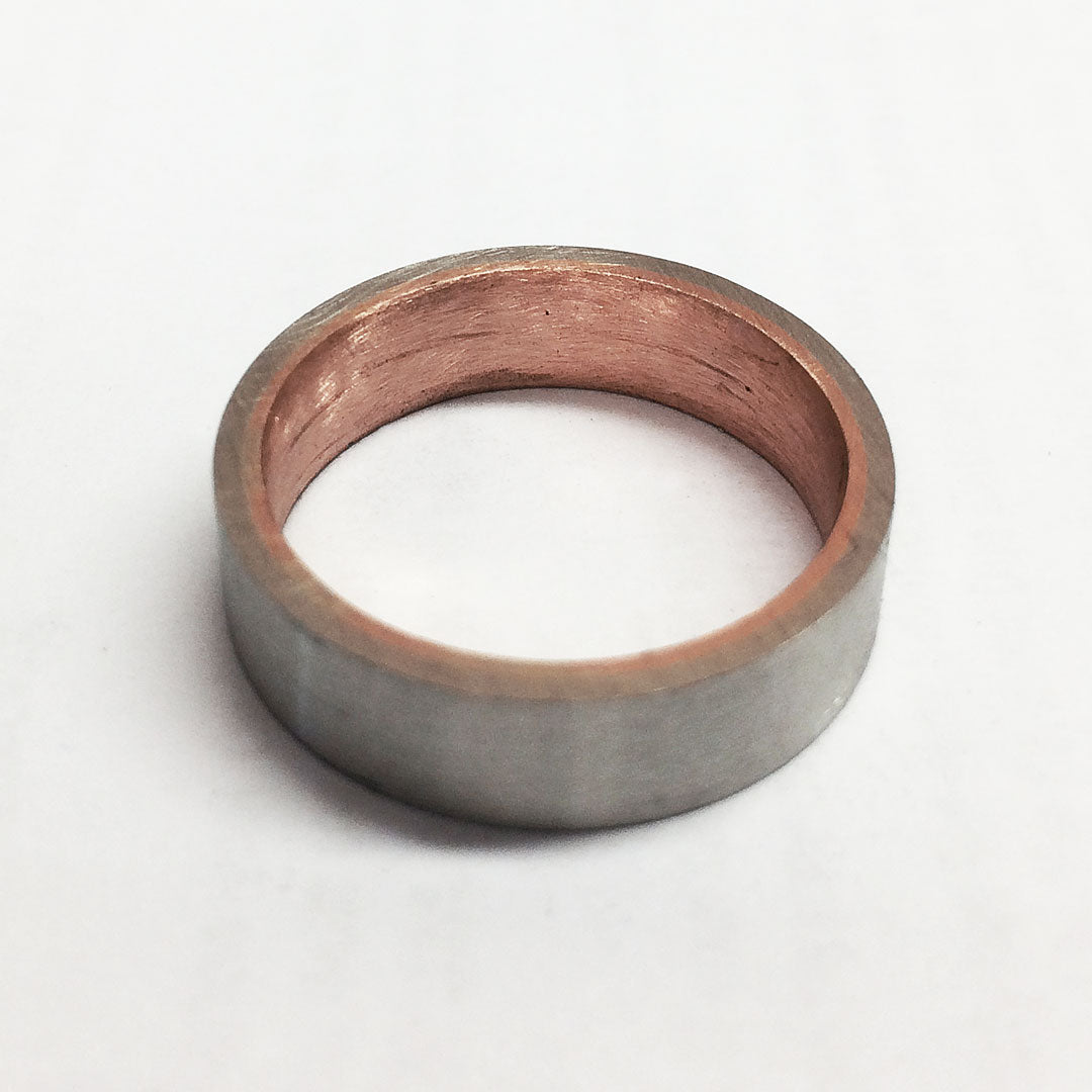 One two-tone 14k gold sleeved ring ready for finishing.