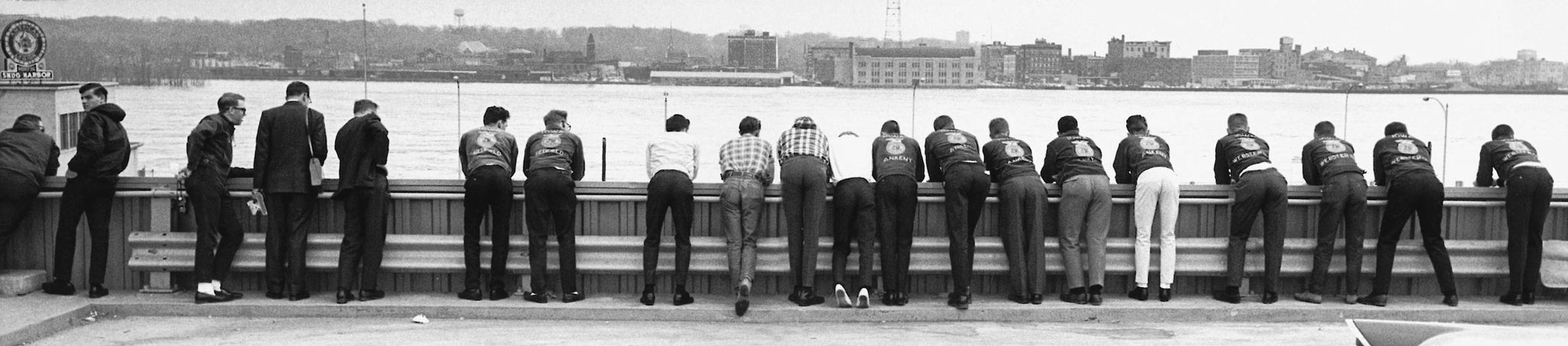 Group looking at the swollen Mississippi River from atop a parking ramp in downtown Davenport, 1965. -- Quad-City Times