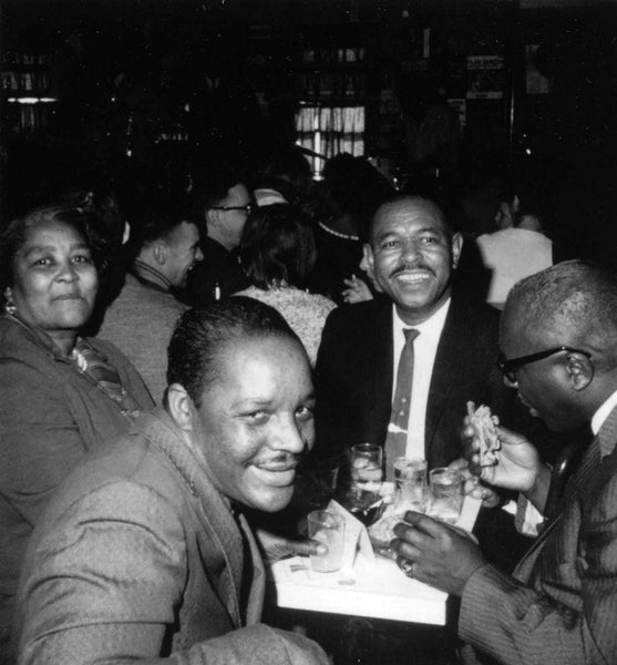 Touring musicians Sonny Terry and Brownie McGhee mingling with customers at Lennie’s in February 1964. -- Salem State Archives